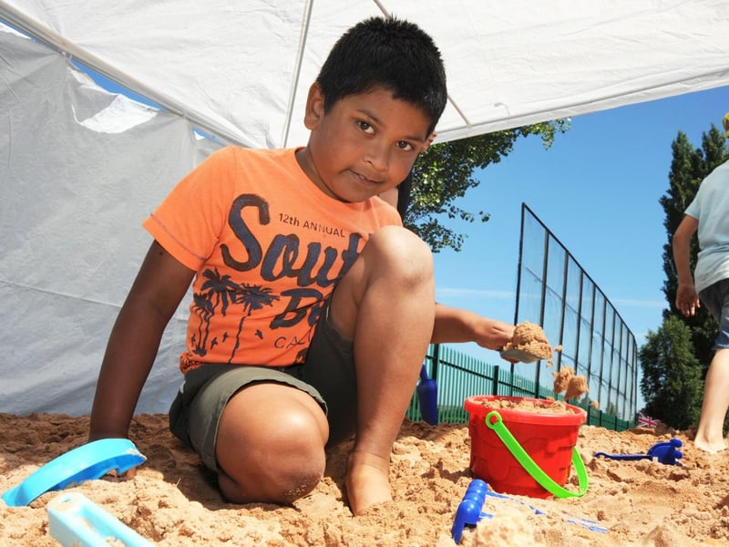 Crescent Primary School's beach day. Farhan starts work on a sand castle.