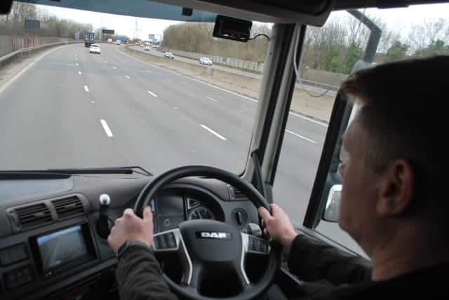 Sgt Bruce Yacomeni at the wheel of the 'supercab' lorry on the M1.