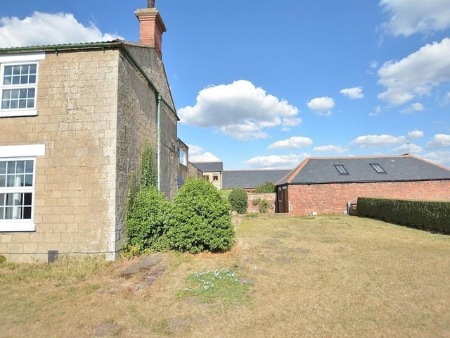 The stone-built house and the well-maintained gardens make for a perfect blend.