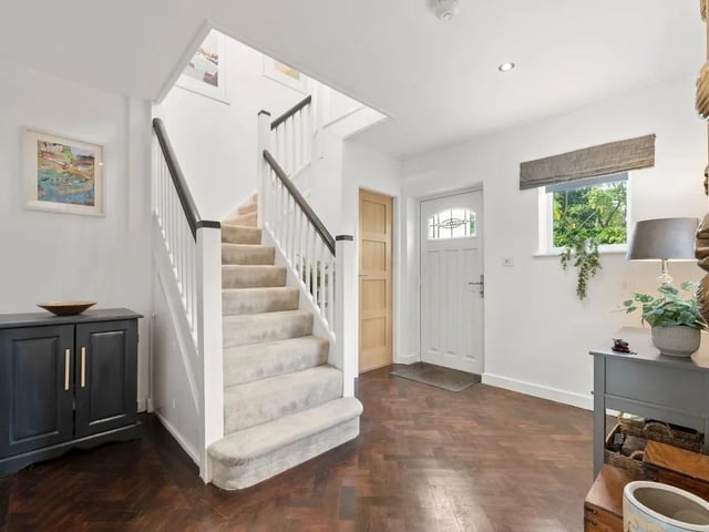 A welcoming entrance hall greets you with an inviting atmosphere thanks to light, bright uPVC windows to the front and side. The property's retained character is evident here in the original characterful parquet flooring.