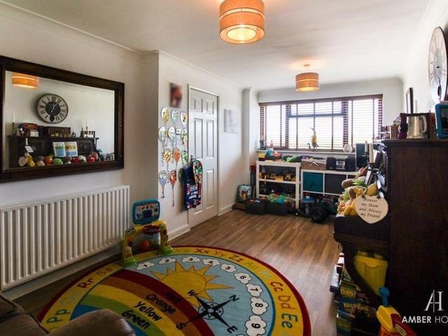 A second reception room on the ground floor is this dining room, which is currently being used a a playroom for the kids. Versatile, it occupies the left-hand portion of the house.