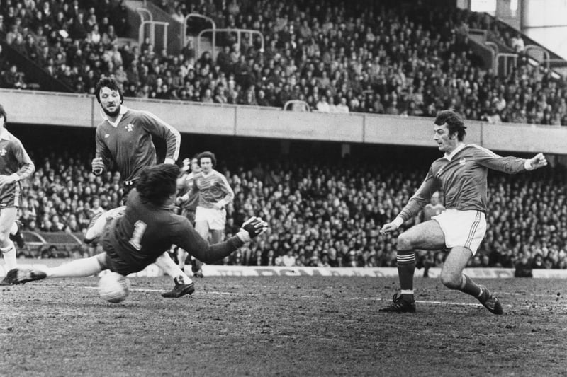 Trevor Francis shoots past Chelsea goalkeeper Petar Borota during their English League Division One match on 7 April 1979 at the Stamford Bridge.