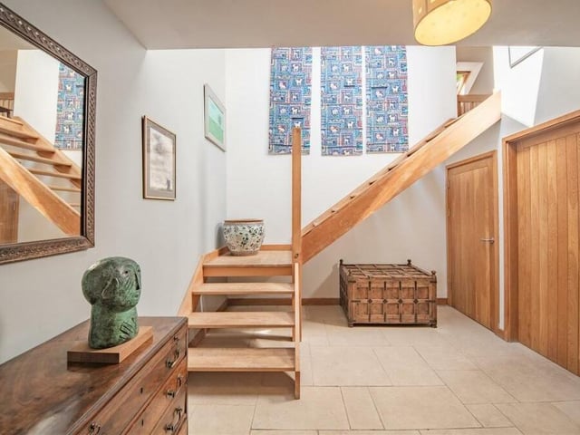 Robust materials, such as oak, have been used throughout the house. Here they help to form a quirky, winding staircase.