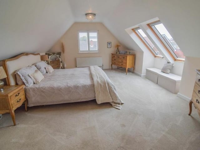 The first double bedroom, which overlooks the front of the house and sits above the garage, is a terrific size. There is plenty of space for furniture.