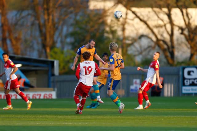 Mansfield Town midfielder John-Joe O'Toole heads clear against Stevenage. Photo by Chris Holloway / The Bigger Picture.media