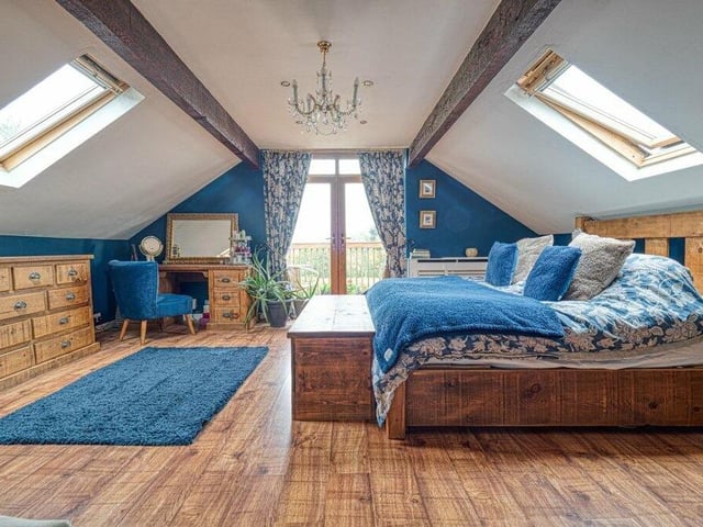 Dual skylight windows let plenty of natural light into the master bedroom at the Jacksdale house.