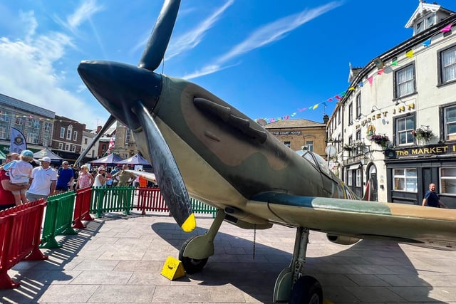 A full-size Spitfire plane was featured in the market place.