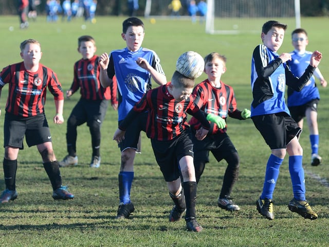 A cracking header away is made during a game between Manor FC v Blidworth Welfare.