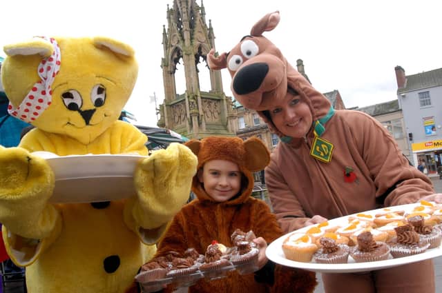 Staff and friends from Pine Lodge Hotel sell cakes on Mansfield market to raise money for Children in Need.