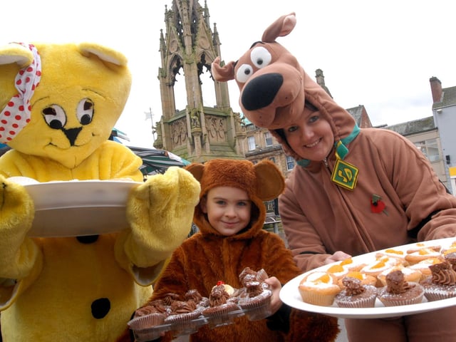 Staff and friends from Pine Lodge Hotel sell cakes on Mansfield market to raise money for Children in Need.
