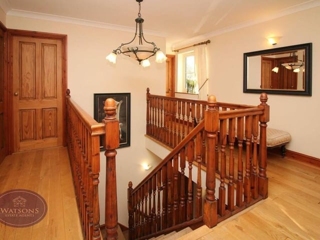 At the top of the stairs, be prepared to be greeted by a stylish landing, which leads to all four bedrooms. It has an exposed wooden floor and access to the attic.
