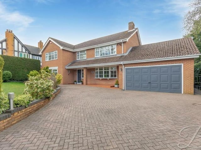The last picture in our gallery shows not only the grand frontage of the High Oakham Road property but also its double garage.To the left is another idyllic lawn with shrubbery. The very definition of 'kerb appeal'.