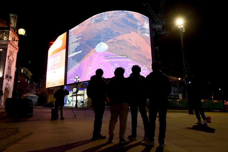 A general view of the live-stream landing of NASA's Perseverance on Mars at Piccadilly Circus.. The rover has been traveling through space since launching from Cape Canaveral at the end of July 2020.
