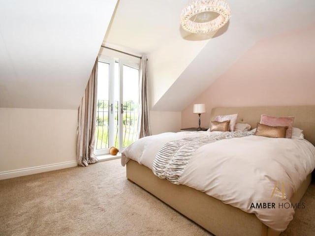 All four double bedrooms are located on the second floor of the £450,000 property, including this master, which features en suite facilities and a mini-balcony overlooking the back garden