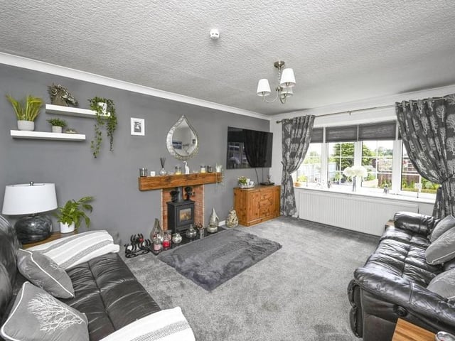 The log-burning fireplace makes the lounge as warm and comfortable as it is bright.
