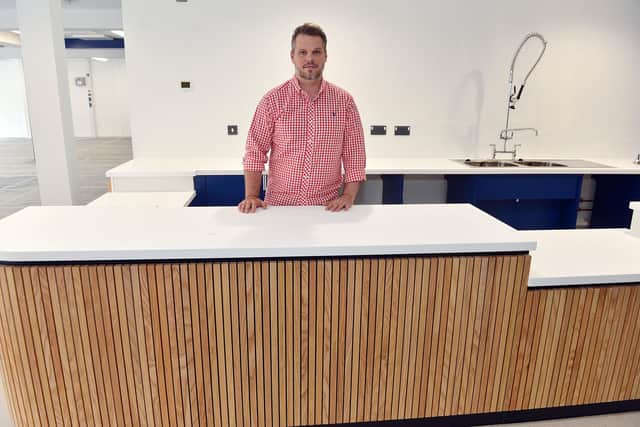 Krzysztof Urbaniak behind the counter of the new Moor Cafe, which he is going to run, in Kirkby's new Moor Market.
