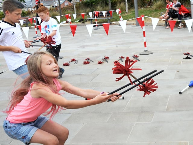 Matilda Hufton, 8, from Kirkby tries her hand at circus tricks.