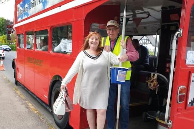 Visitors riding on the red bus at the Greasley Gathering.