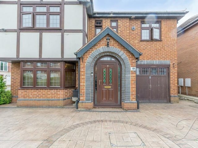 Let's return to the front of the £365,000 house for the last photo in our gallery. The spacious driveway provides off-street parking space and leads to a garage that is handy for storage.