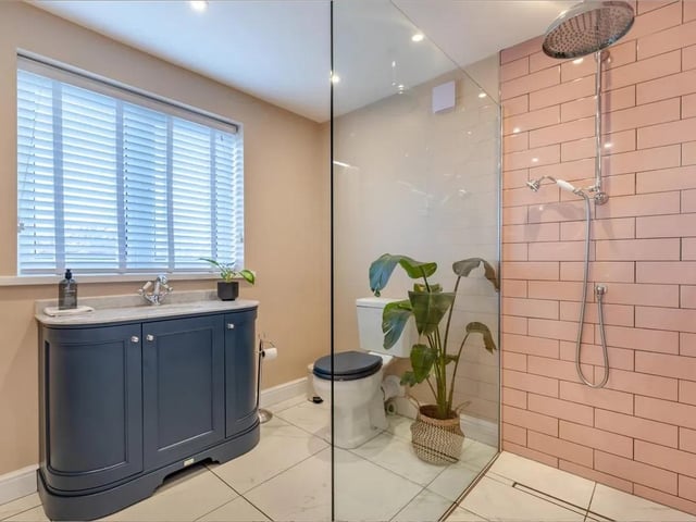 The property is stylishly decorated throughout. The second ensuite has a modern shower with built-in radio and body jets. Low flush WC. Vanity unit with inset wash hand basin with mixer tap. Radiator, vinyl floor and velux roof to the rear elevation.