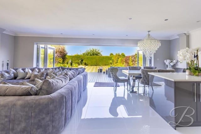 The hub of the Derby Road house is this open-plan space that features the main living area to the left and the kitchen/diner to the right. In between are huge bi-fold doors that open up to give spectacular views of the back garden and beyond.