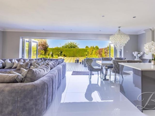 The hub of the Derby Road house is this open-plan space that features the main living area to the left and the kitchen/diner to the right. In between are huge bi-fold doors that open up to give spectacular views of the back garden and beyond.