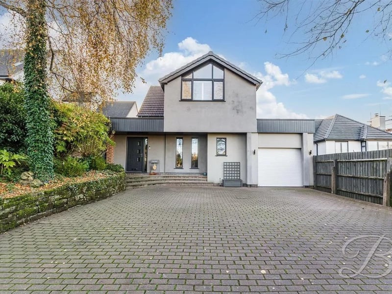 There is a private gated driveway and garage, allowing for ample off-street parking.