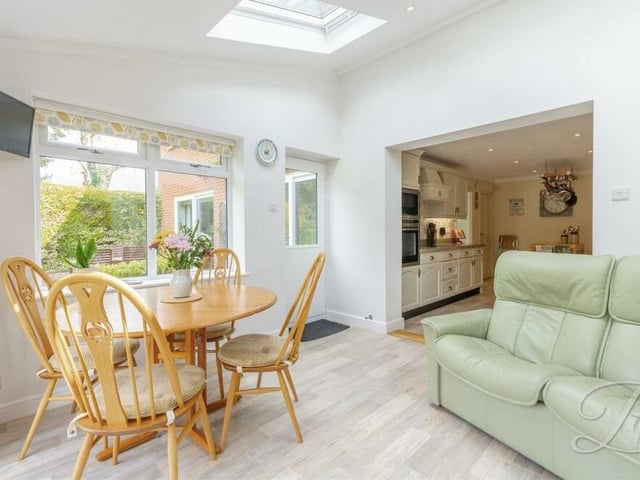 The kitchen leads seamlessly into this breakfast or garden room, which has three skylight windows and space for a breakfast table.