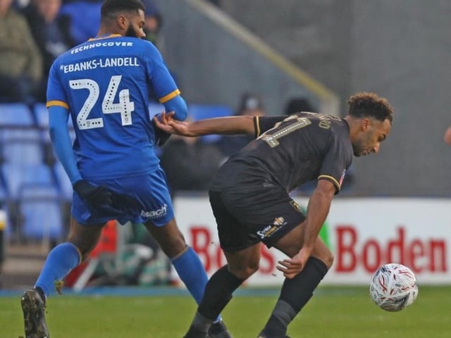 Nicky Maynard holds off a Shrews opponent.