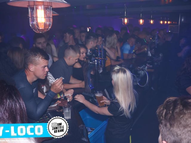 Grabbing a drink from the bar