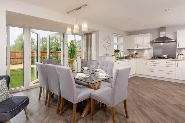 A typical kitchen and dining area in a Holden at Fernwood Village