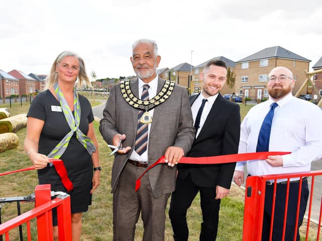 Cllr Paul Grafton opening the play area with Angela Lattuca, Josh Malone and Tom Jordan