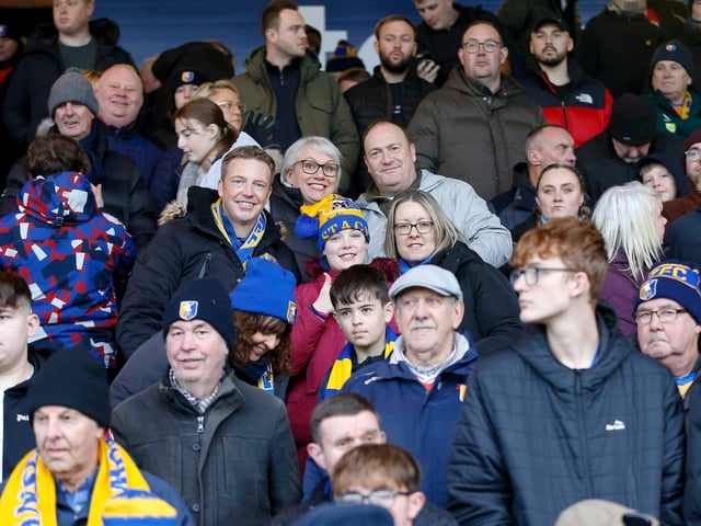 Mansfield Town fans enjoy the win at Stockport County.