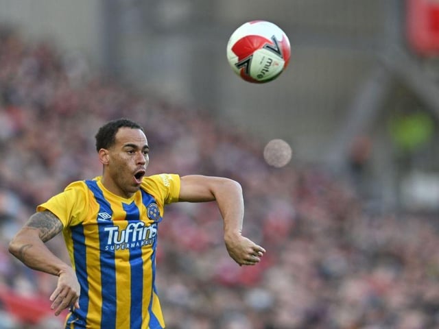 Shrewsbury Town's English midfielder Elliott Bennett takes a throw-in during the English FA Cup third round football match between Liverpool and Shrewsbury Town at Anfield in Liverpool, north west England on January 9, 2022. - Liverpool won the match 4-1. - RESTRICTED TO EDITORIAL USE. No use with unauthorized audio, video, data, fixture lists, club/league logos or 'live' services. Online in-match use limited to 120 images. An additional 40 images may be used in extra time. No video emulation. Social media in-match use limited to 120 images. An additional 40 images may be used in extra time. No use in betting publications, games or single club/league/player publications. (Photo by Paul ELLIS / AFP) / RESTRICTED TO EDITORIAL USE. No use with unauthorized audio, video, data, fixture lists, club/league logos or 'live' services. Online in-match use limited to 120 images. An additional 40 images may be used in extra time. No video emulation. Social media in-match use limited to 120 images. An additional 40 images may be used in extra time. No use in betting publications, games or single club/league/player publications. / RESTRICTED TO EDITORIAL USE. No use with unauthorized audio, video, data, fixture lists, club/league logos or 'live' services. Online in-match use limited to 120 images. An additional 40 images may be used in extra time. No video emulation. Social media in-match use limited to 120 images. An additional 40 images may be used in extra time. No use in betting publications, games or single club/league/player publications. (Photo by PAUL ELLIS/AFP via Getty Images) : Last club: Shrewsbury TownPosition: Midfield