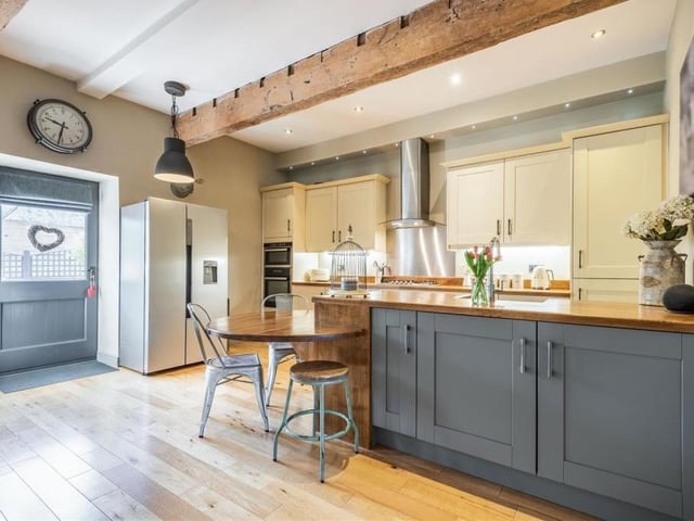 The open-plan kitchen/diner really does boast everything you need, including an inset ceramic sink with chrome mixer tap, and an integrated dishwasher.