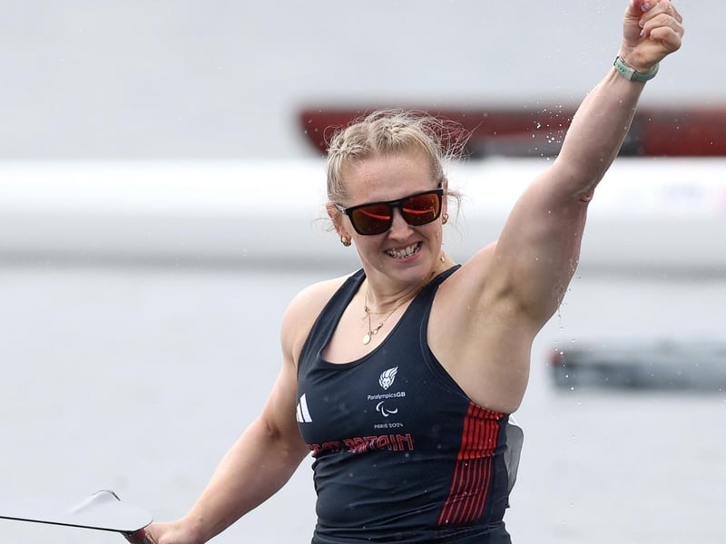 Charlotte Henshaw celebrates winning the Women's Va'a 200m final.