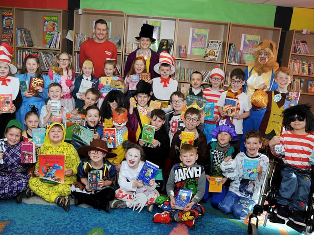 Pupils from the Peafield Lane Academy in 2018 are joined by class teacher Katie Kier, teaching assistant Jayne Hymas and Paul Haywood from Forever Young Fancy Dress, on Toothill Lane, who provided the pupils with a costume for World Book Day after the class won a competition post on Facebook.
