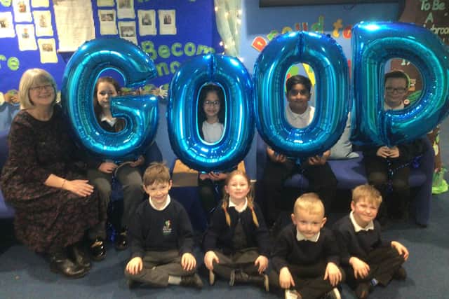 Karen Jagger, The Flying High Academy headteacher, celebrates the school's good Ofsted report with pupils.