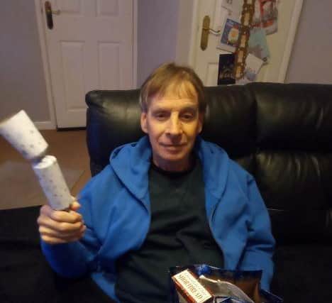 Patient David receiving his gift.