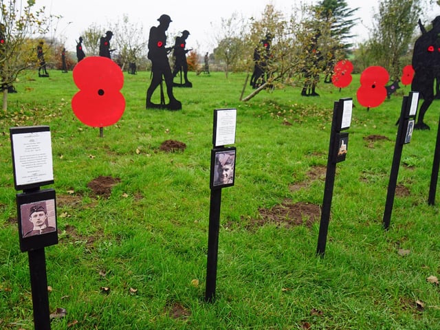 Extensive research has been conducted to gather information about the names on the cenotaph, as the group shares the soldiers' stories along the roadside in Warsop.