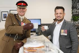 Cheers! Lt Col Keith Spiers (left), of the Army, who performed the opening ceremony, shares a cuppa with former soldier Andy Brewster, the businessman behind Spectre Coffee.