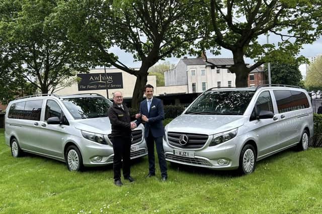 Mertrux sales controller Frank Murray hands over the vehicles to Matthew Lymn Rose, AW Lymn managing director. (Photo by: AW Lymn The Family Funeral Service)