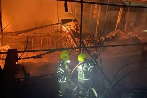 Firefighters tackling the blaze at Savanna Rags.