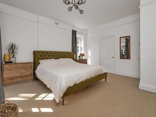 And so to the master bedroom, which has its own walk-in wardrobe and en suite facilities. There are windows facing the back and side of the property.