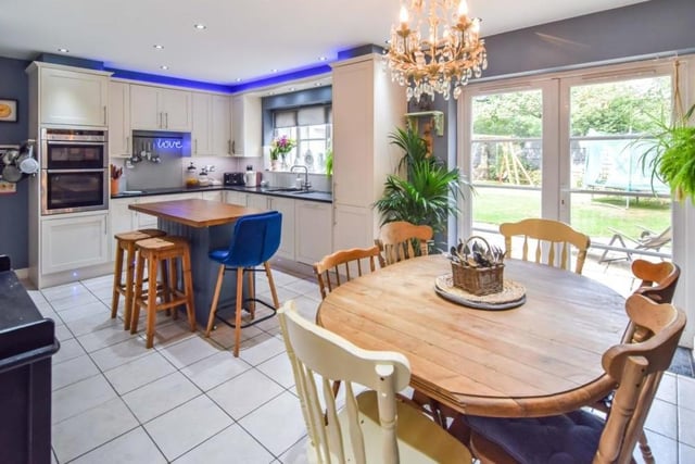 We begin our tour of the Paddock Close house in the bright and spacious kitchen/diner, which has French doors that open out on to the back garden. Fixtures include an integrated oven, microwave, hob, dishwasher and fridge/freezer.