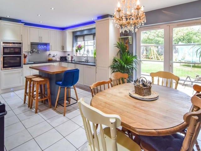 We begin our tour of the Paddock Close house in the bright and spacious kitchen/diner, which has French doors that open out on to the back garden. Fixtures include an integrated oven, microwave, hob, dishwasher and fridge/freezer.