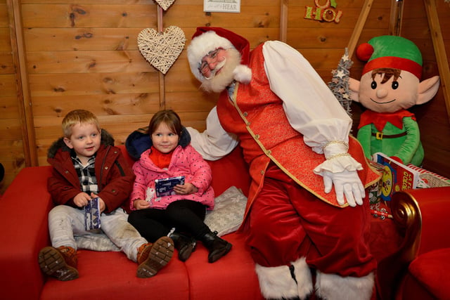 Pictured meeting Santa are William Dexter, three and Holly Lawrence, three