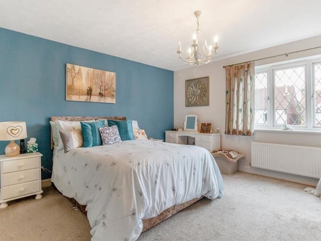 The first of the five bedrooms is the master, a bright and sizeable space with a double-glazed window facing the front of the £470,000 house.