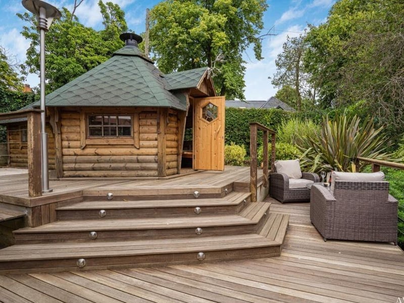 An imaginative addition to the back garden is this wooden chalet-style building, known as a kota. Do you want to take a look inside?.........