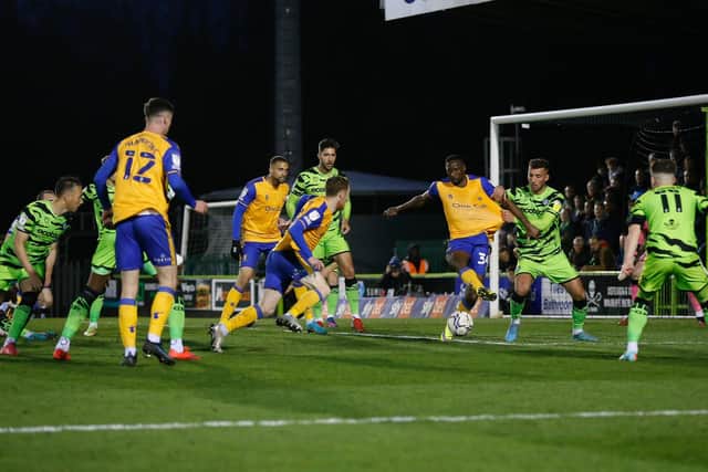 Lucas Akins is held back by a Forest Green defender. Photo by: Chris Holloway/The Bigger Picture.media